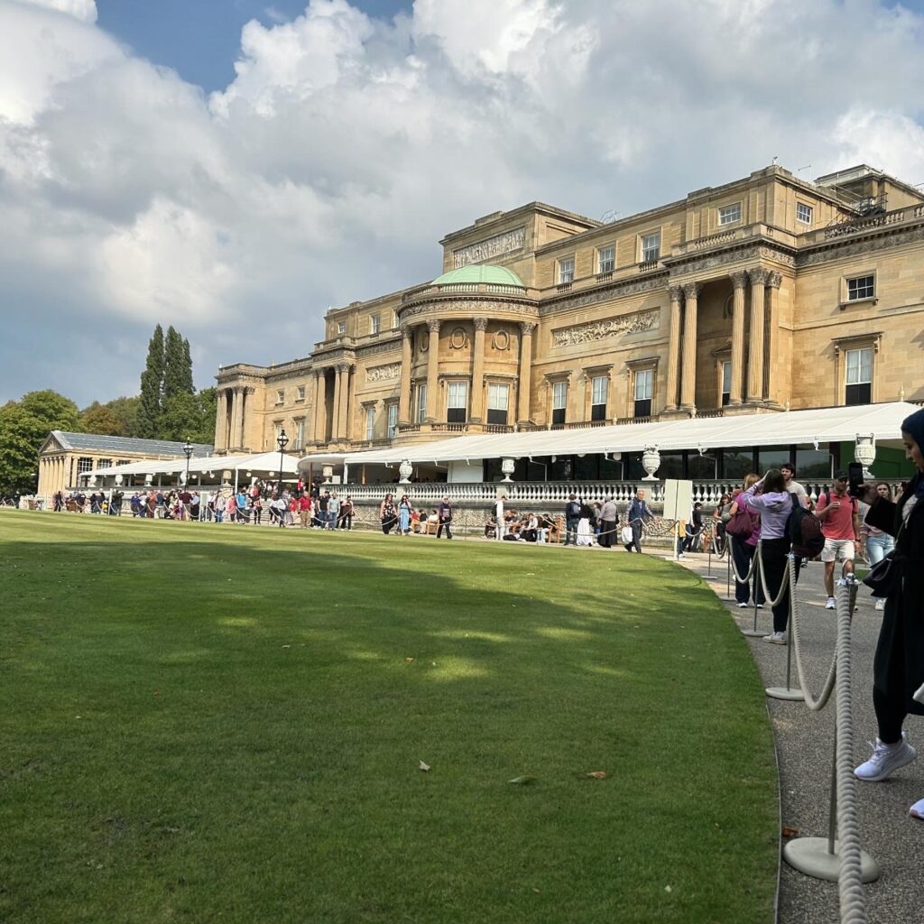 A view of the gardens at the backside of Buckingham Palace, a royal landmark featured in our London travel guide.