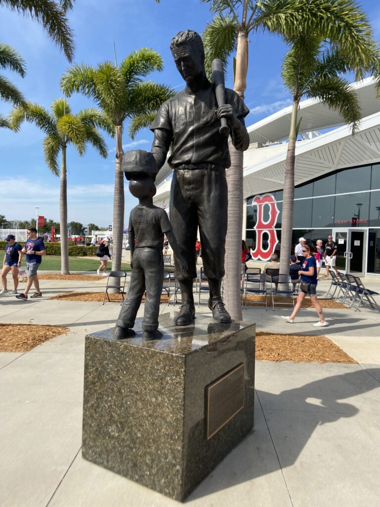 Bronze Ted Williams statue greeting visitors at JetBlue Park, a highlight for fans in our Florida travel guide.