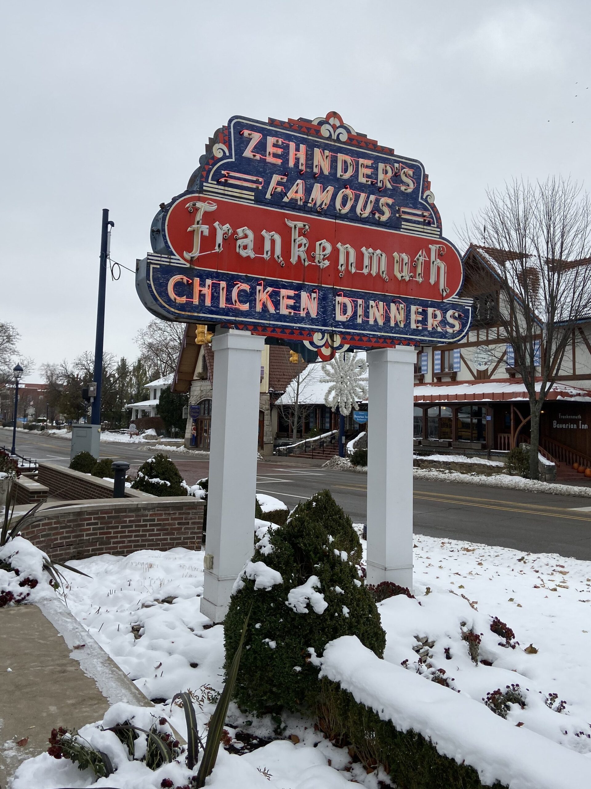 A Frankenmuth tradition, Zehnder’s has been serving up delicious fried chicken meals and more since 1856. The historic neon Zehnder's Famous Chicken Dinners sign standing in front of the snowy Bavarian Inn during a Frankenmuth Michigan Christmas visit.