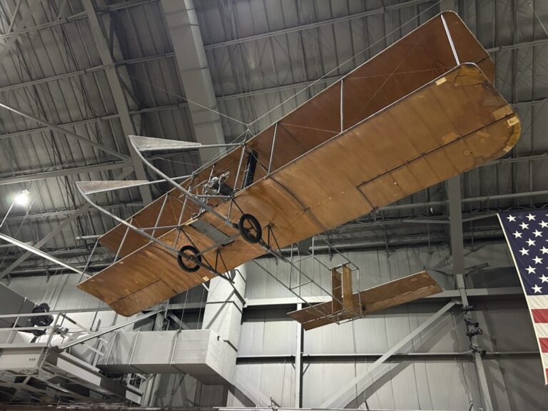 A historic Wright Brothers biplane suspended from the ceiling at the National Museum of the US Air Force in Dayton, Ohio.