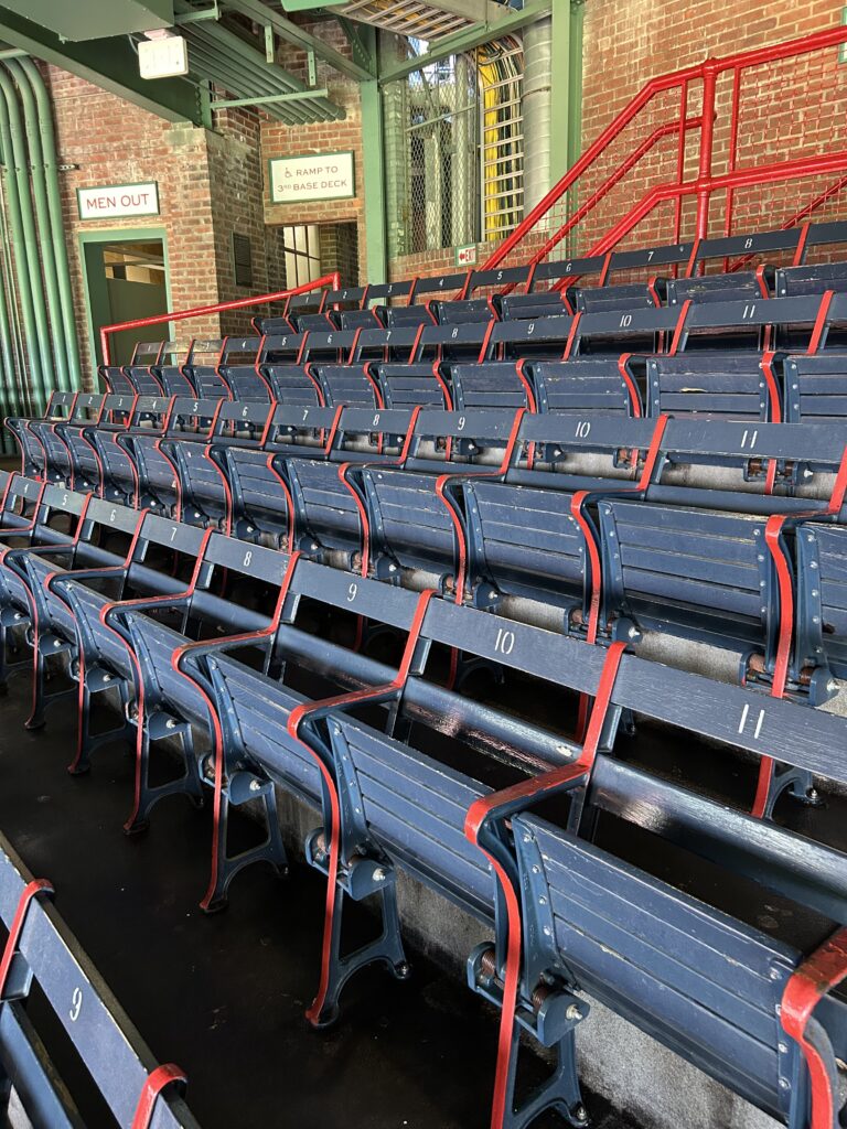 A close-up view of the historic blue folding grandstand seats, the oldest seats in the pride of MLB, seen on our Fenway Park tour.