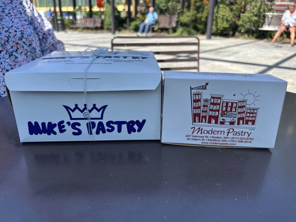 mike's pastry and modern pastry boxes side by side in north end boston