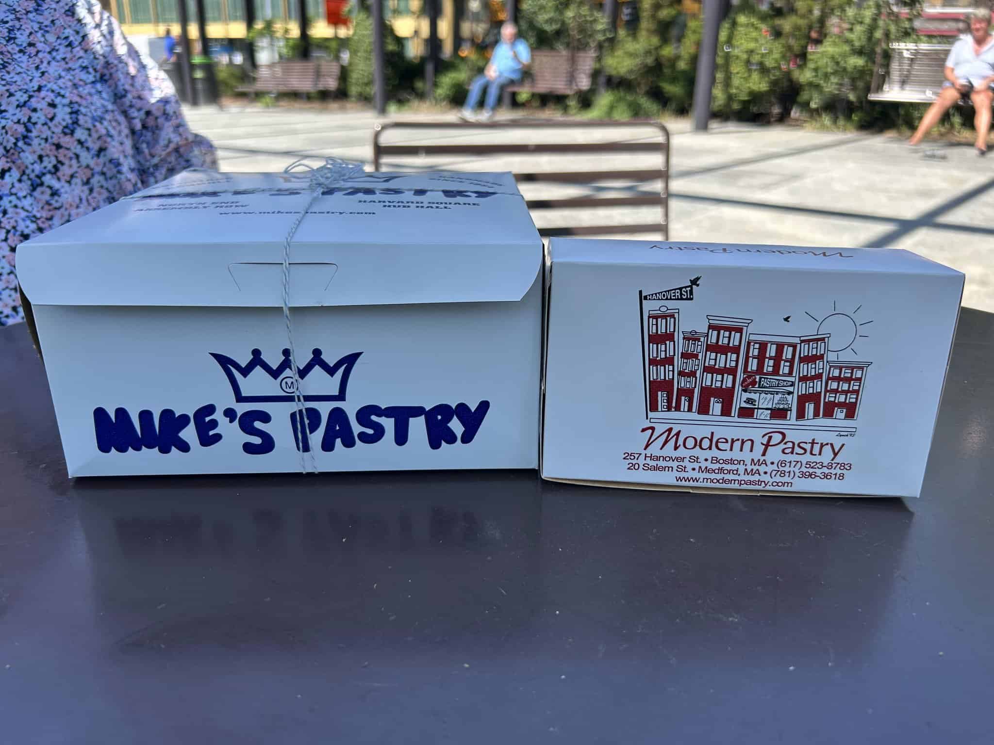 mike's pastry and modern pastry boxes side by side in north end boston