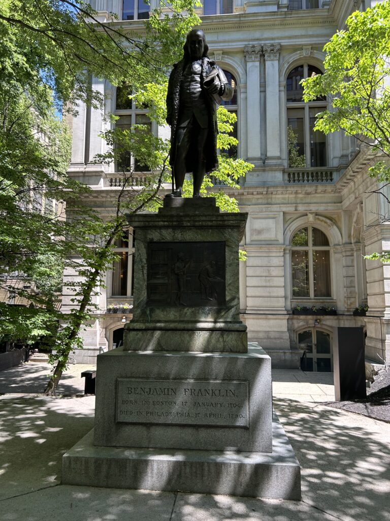 walking the boston freedom trail benjamin franklin statue in downtown boston